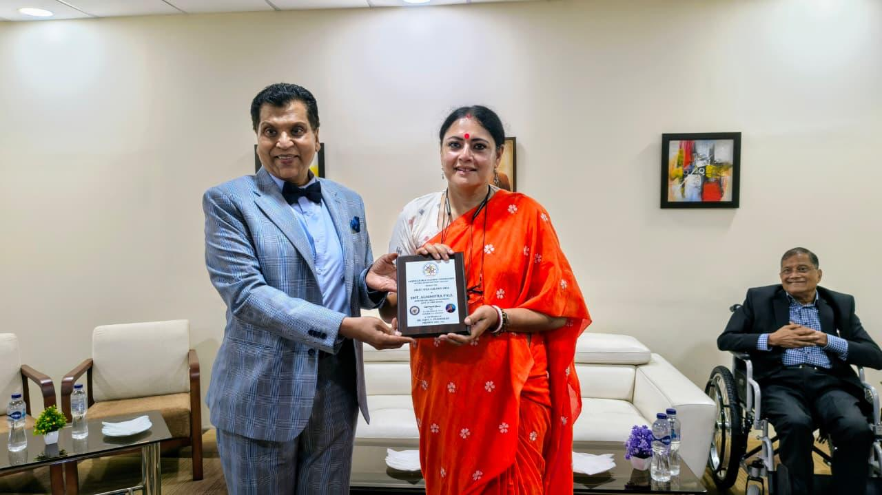 Dr. VGP presenting AMEC Colors to Ms. Agnimitra Paul